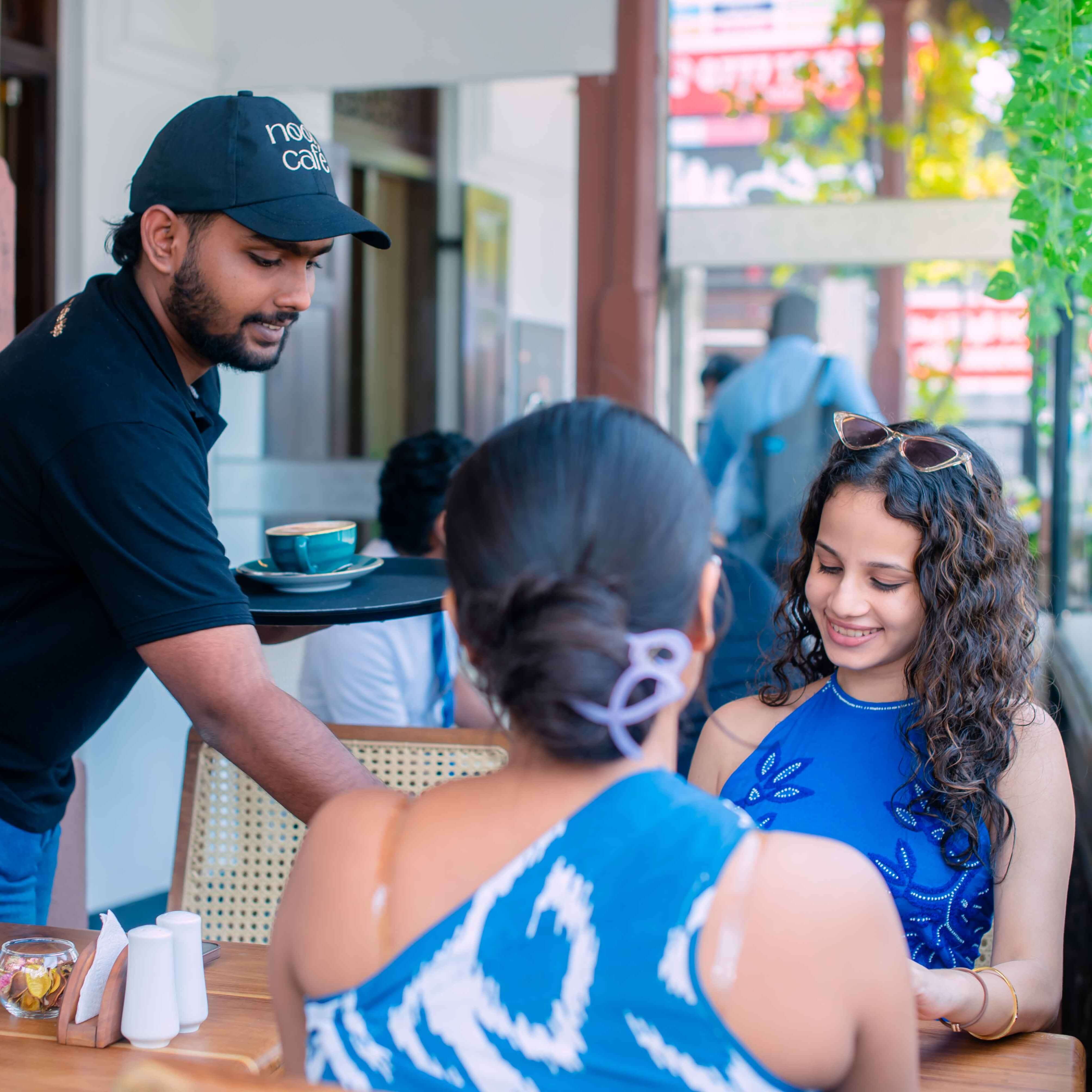 Nook Cafe vibrant evening atmosphere showcasing live kitchen and intimate dining experience